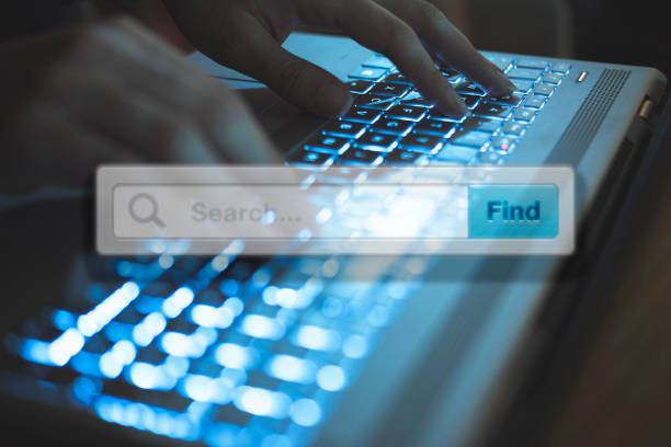 Google search overlay on a person typing on a laptop keyboard, symbolizing online searches.