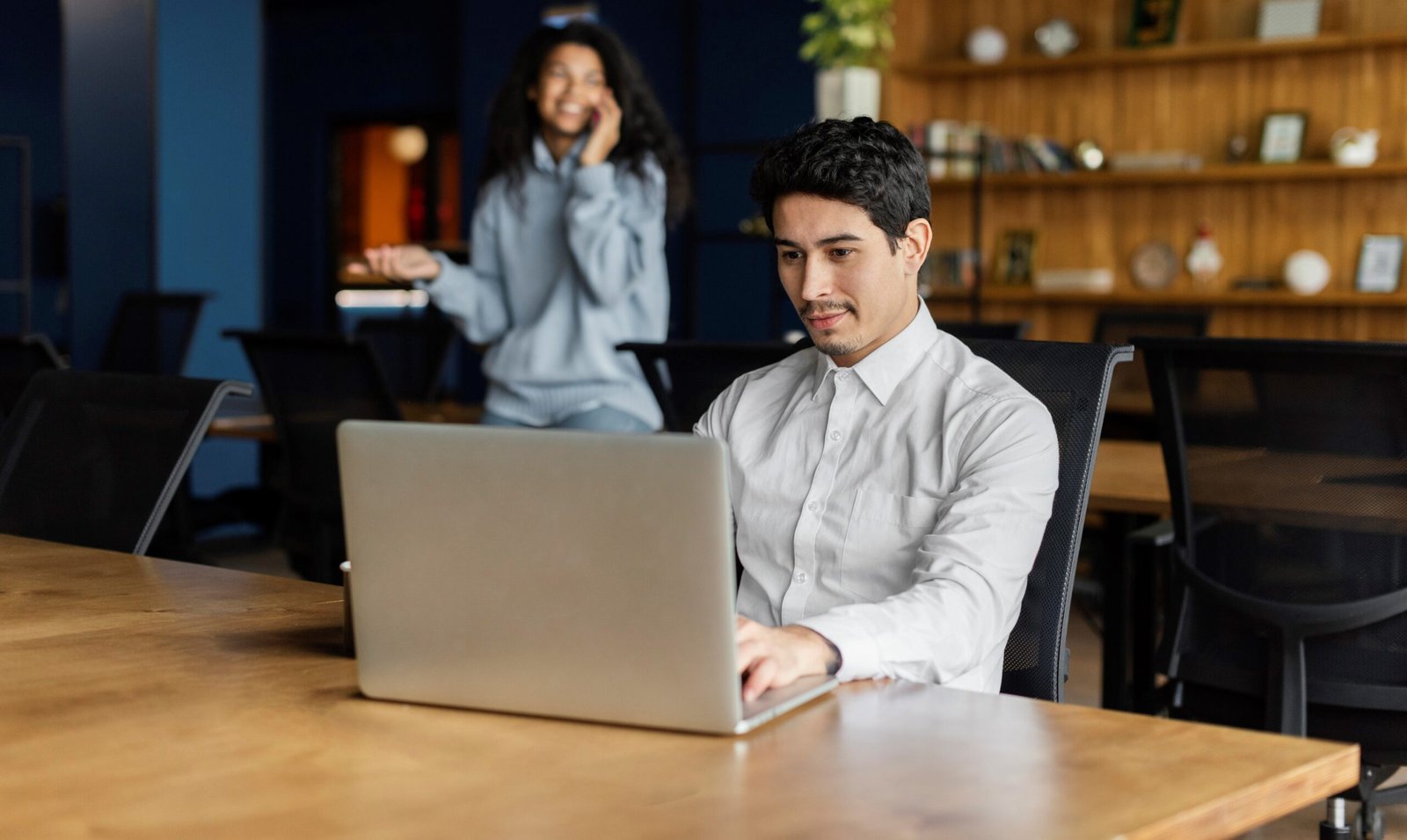 Small business owner reading a online negative review on a laptop