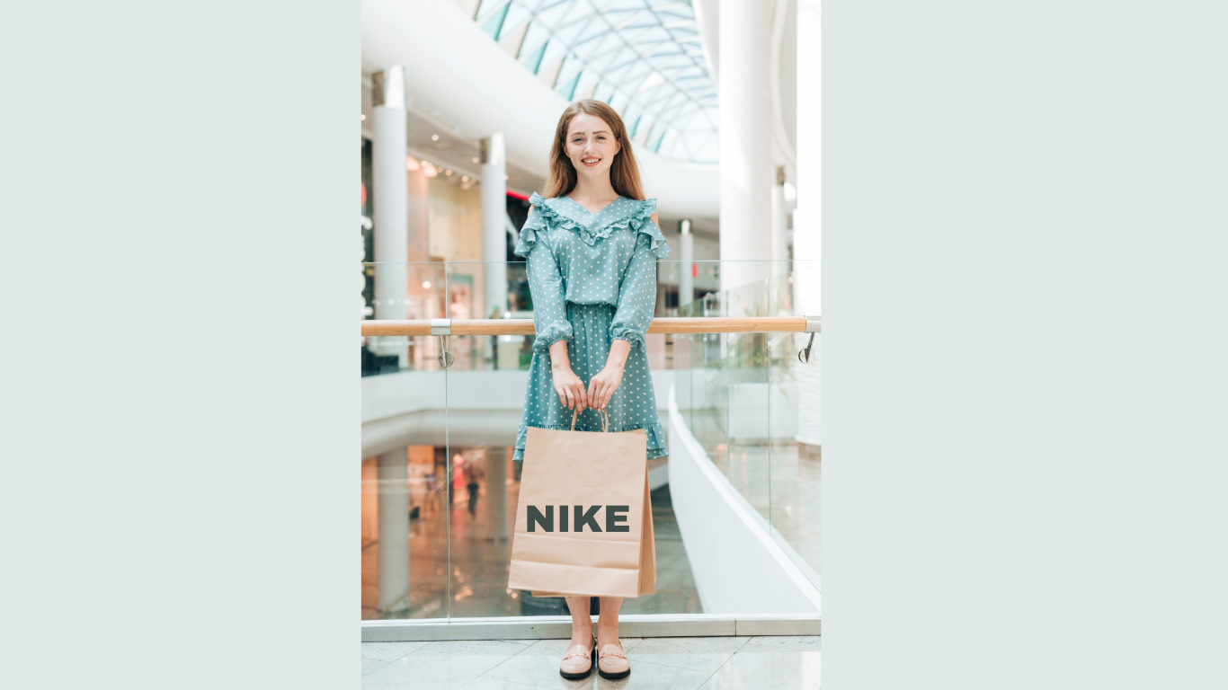 Happy shopper influenced by brand psychology while making a purchase.