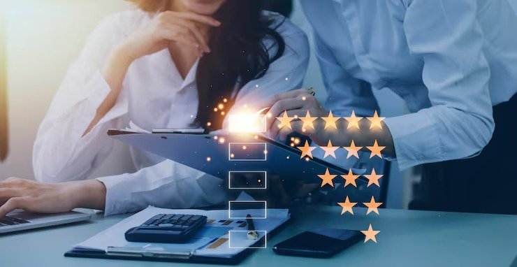 Business professionals analyzing digital performance with five-star rating icons, representing online reputation signals and user trust that Google rewards for new websites.