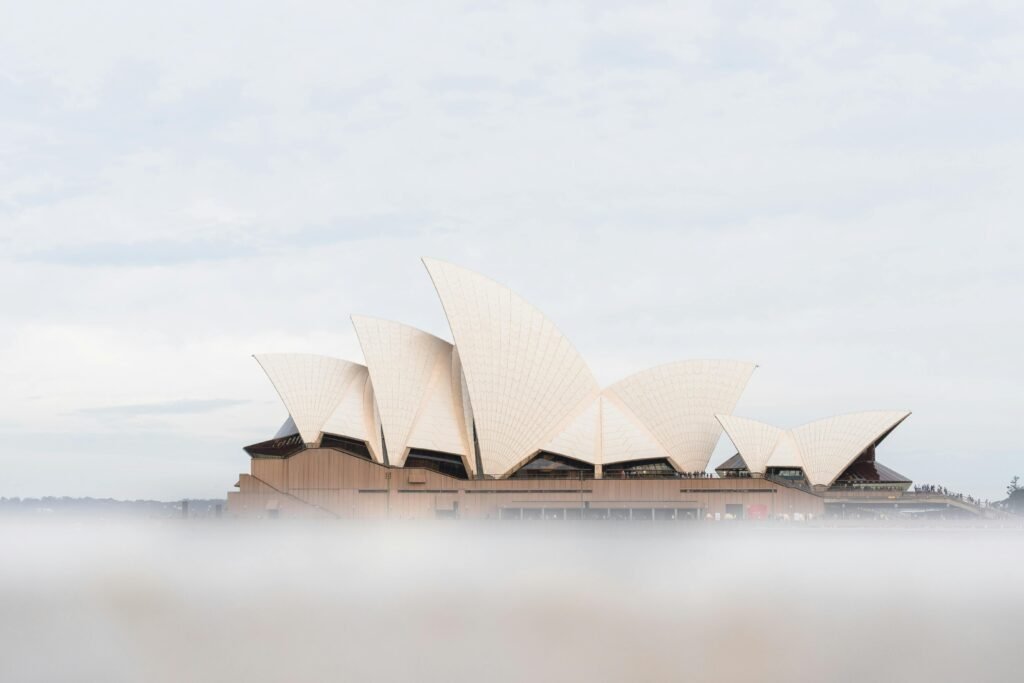 Sydney Opera House emerging through light mist, symbolizing reputation clarity and the removal of negative search results for Sydney professionals.