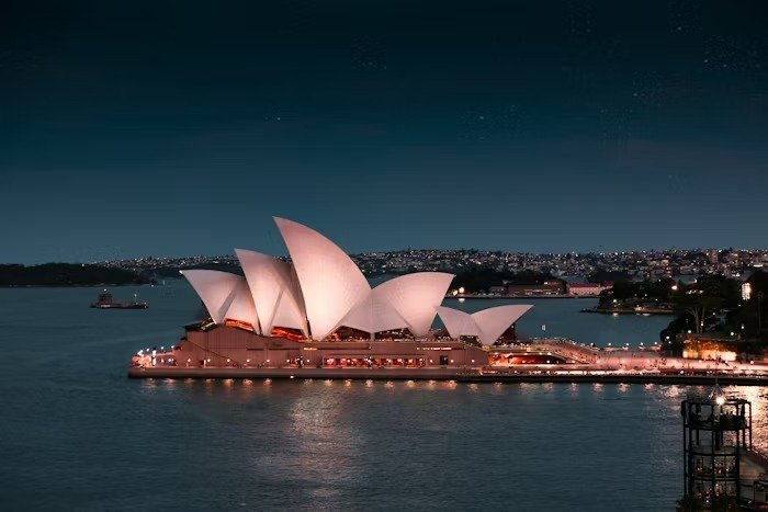 Sydney Opera House at night overlooking the harbour, symbolizing visibility, trust, and the importance of online reputation management for Sydney businesses.
