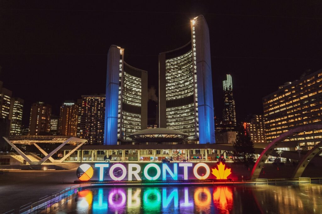 Toronto City Hall illuminated at night, symbolizing ethical online reputation management and clear search results for businesses and professionals in Toronto.