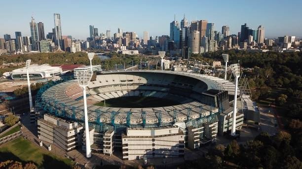 Aerial view of a major city stadium surrounded by skyscrapers, representing long-term visibility and structural digital growth.