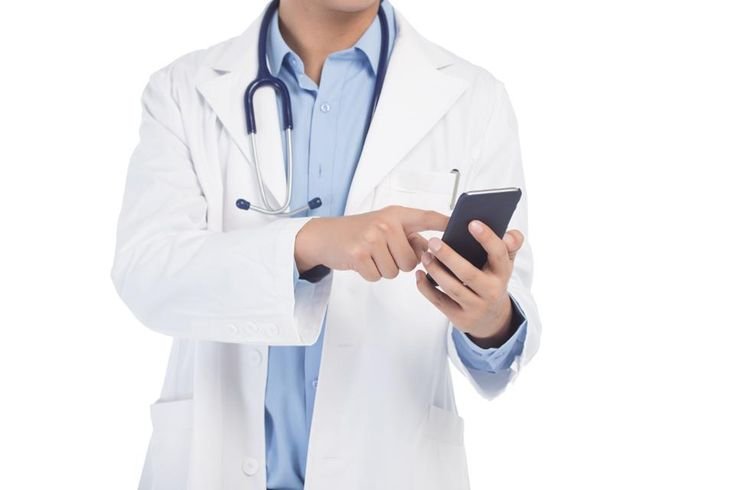 Doctor reviewing patient records in a clinic